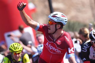 Alexander Kristoff raises his arm in celebration