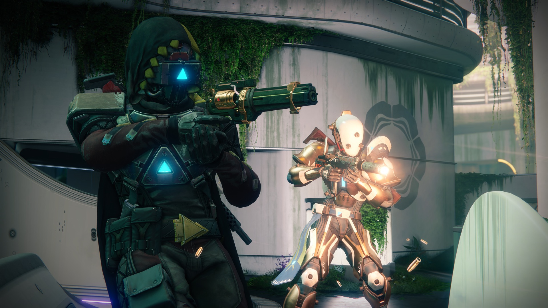 Two players in elaborate armor hold weapons in Destiny 2