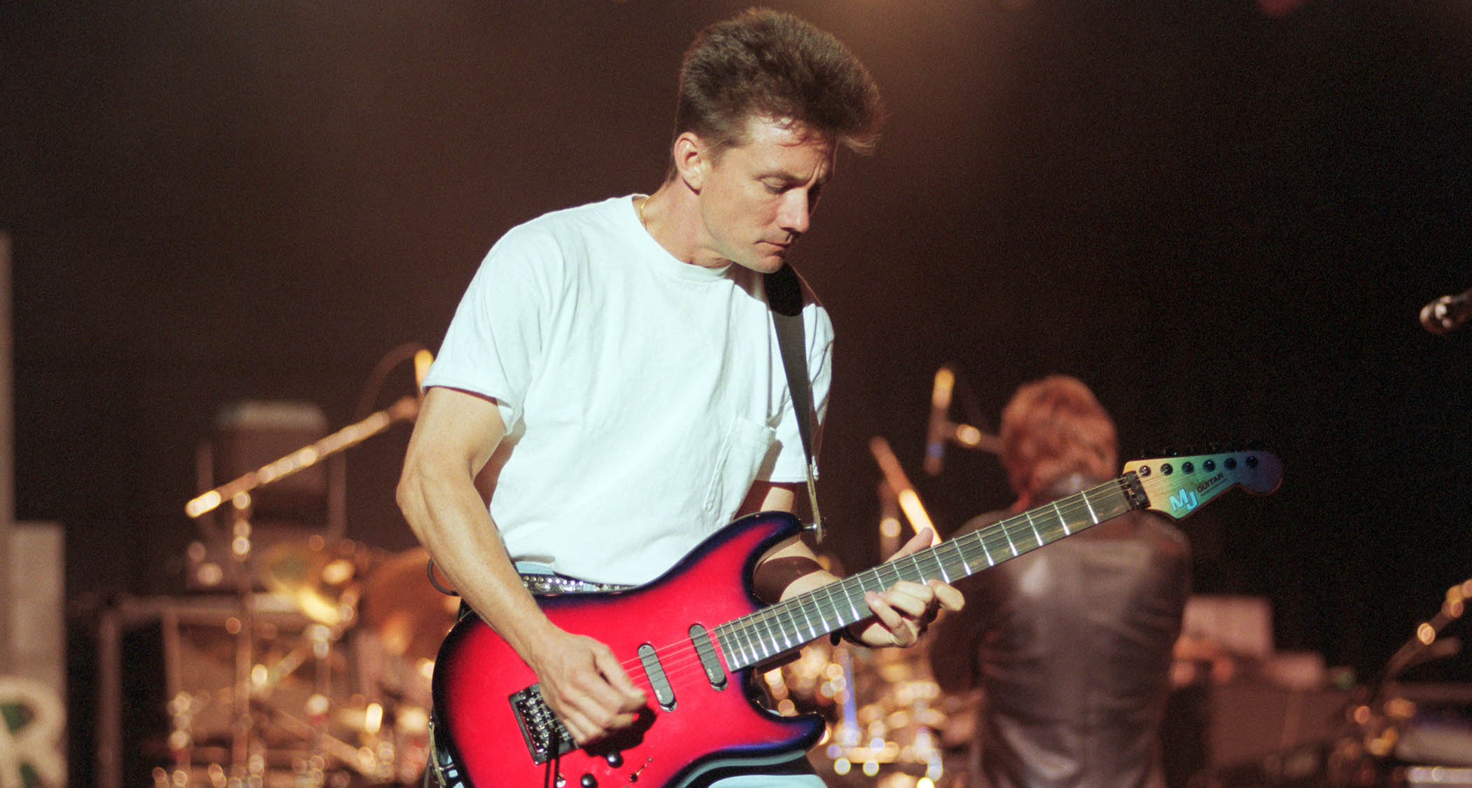 Chris Hayes of Huey Lewis and the News performs live with his red burst MJ S-style in 1991