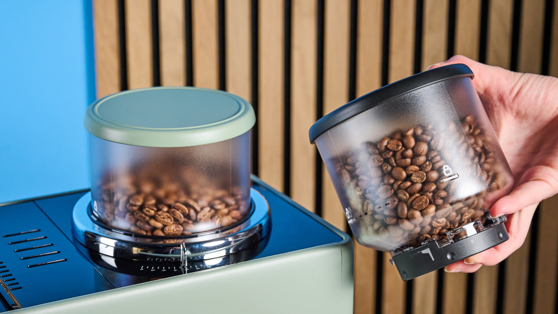 the de'longhi rivelia automatic superautomatic coffee machine in sage green with a bright LED screen, two interchangeable bean hoppers, an automatic milk frother, and a huge range of coffee recipes