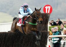 Best Mate jumps the last with Jim Culloty up on their way to win the Cheltenham Gold Cup, 14 March 2002, at the Cheltenham Festival. Credit: GERRY PENNY/AFP via Getty Images)