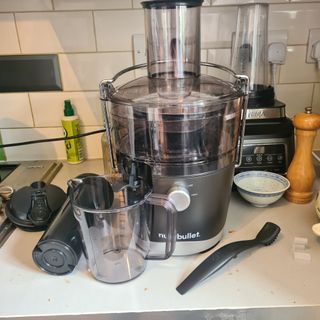 Nutribullet with accessories on a kitchen counter top