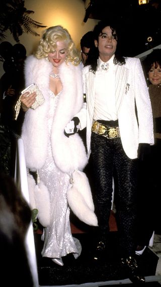Madonna in a white dress and matching fur coat