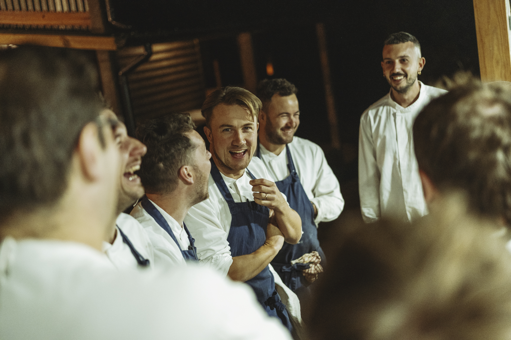 Group of chefs in blue aprons