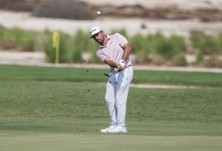 Daniel Van Tonder of South Africa plays a pitch shot during the third round of the Commercial Bank Qatar Masters