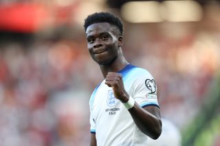 Bukayo Saka celebrates after scoring for England against North Macedonia in June 2023.