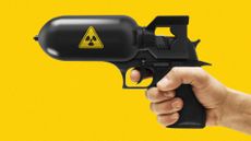 Photo composite illustration of a hand pointing a handgun mounted with a nuclear bomb