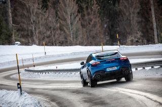 Ferrari Purosangue on road amid snow