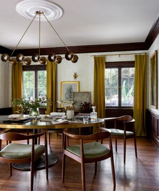 dark wood dining room with modern light fixture
