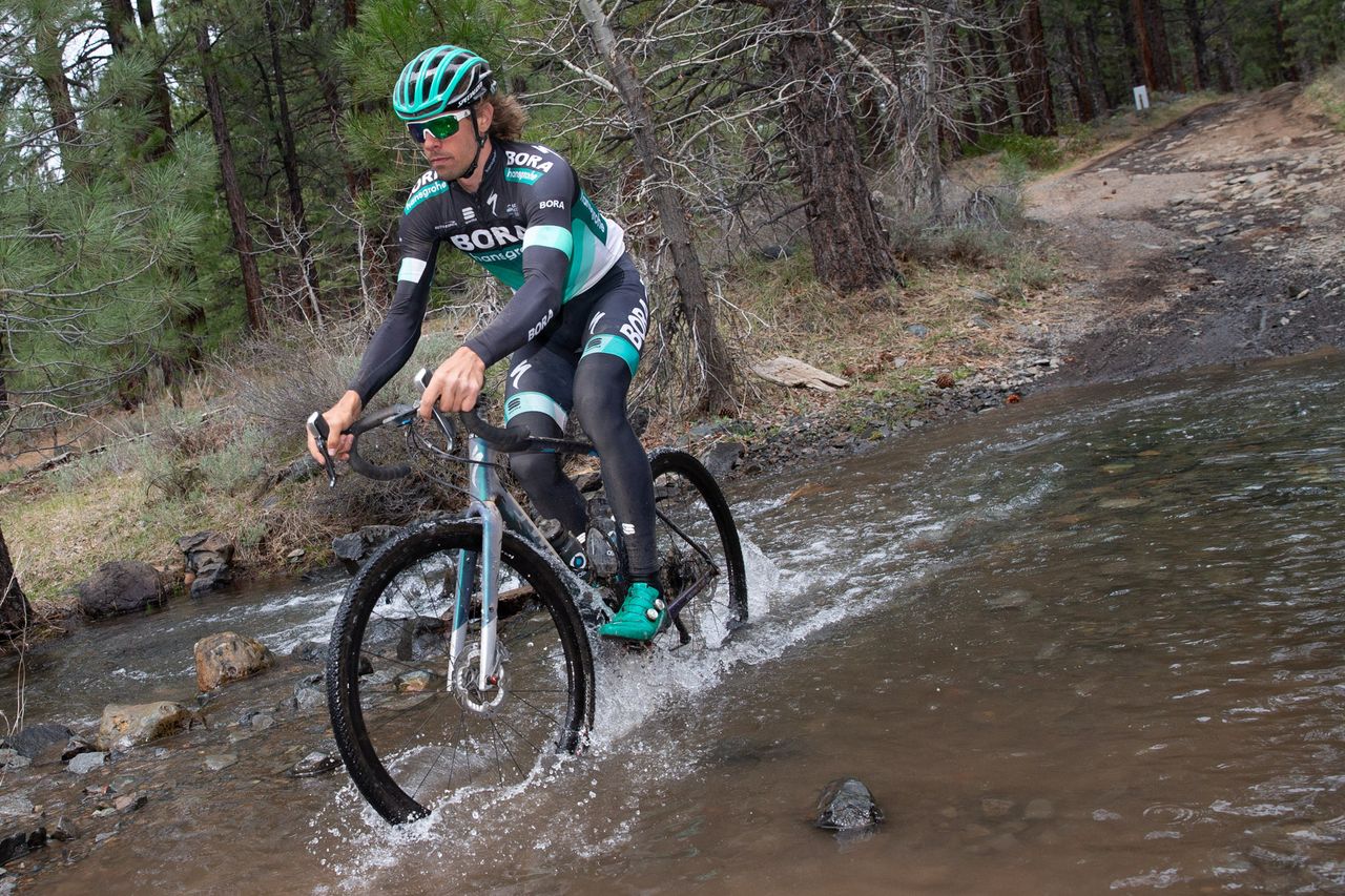 Daniel Oss crosses a river during the Sagan Fondo