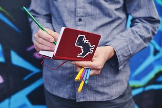 Logo design inspiration: man drawing in notebook