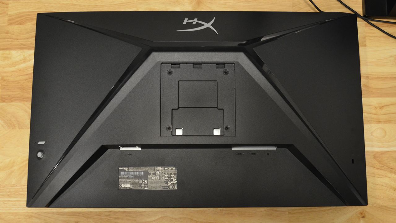A HyperX Armada 27 on a wooden desk