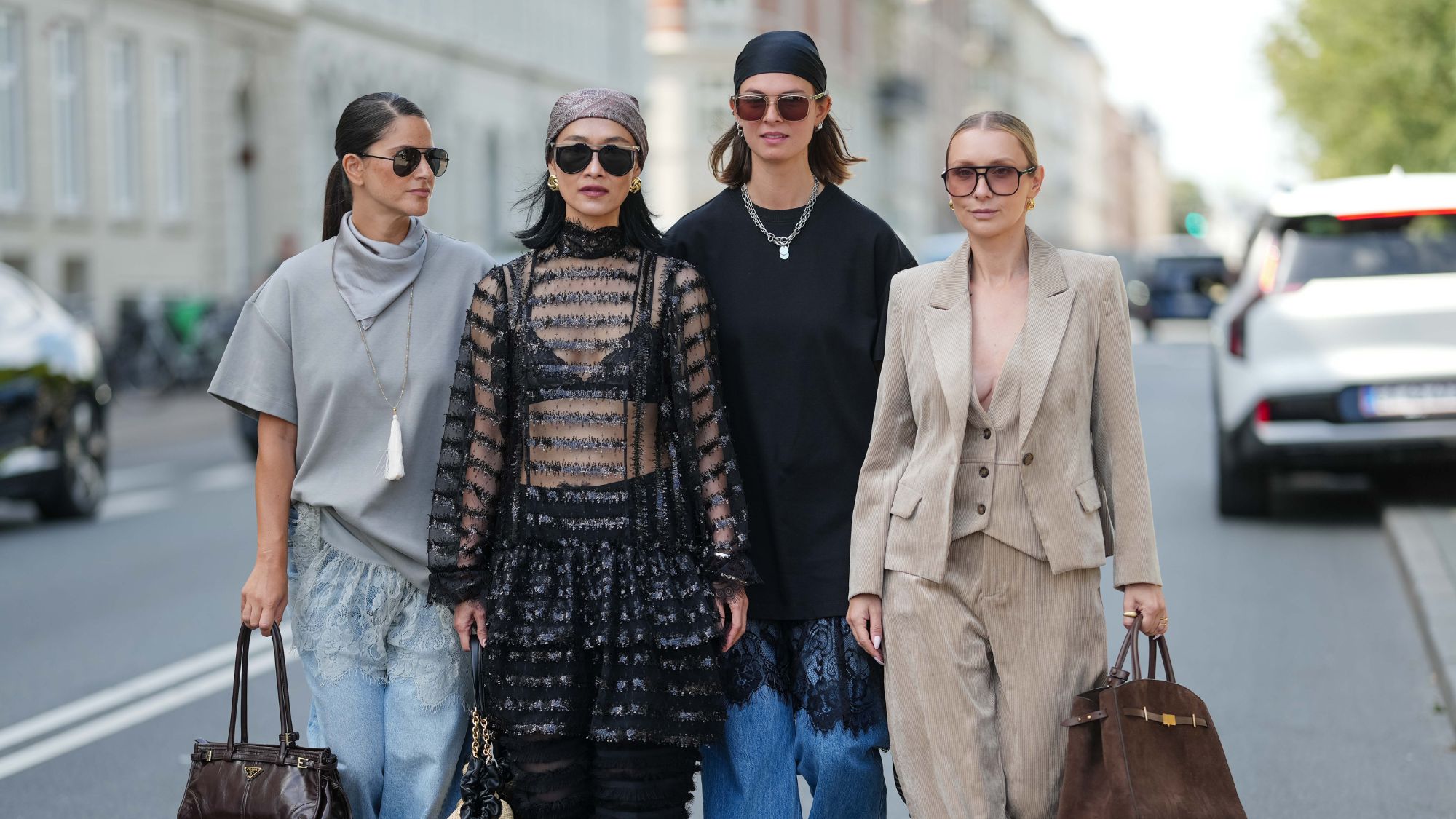 four women photographed walking on the street during Copenhagen Fashion Week