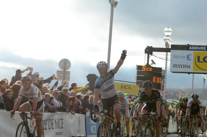 Sylvain Chavanel (Omega Pharma-Quick Step) celebrates victory while runner-up Philippe Gilbert (BMC) rues his missed chance.