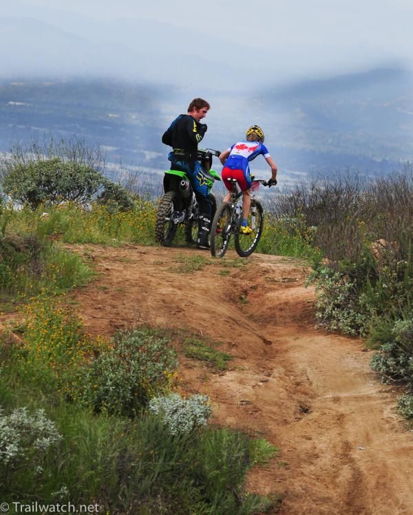 Catherine Pendrel (Luna Pro Team) passes Ty Kady, who piloted the lead moto