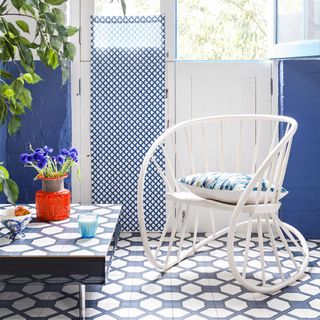 room with blue wall and white chair