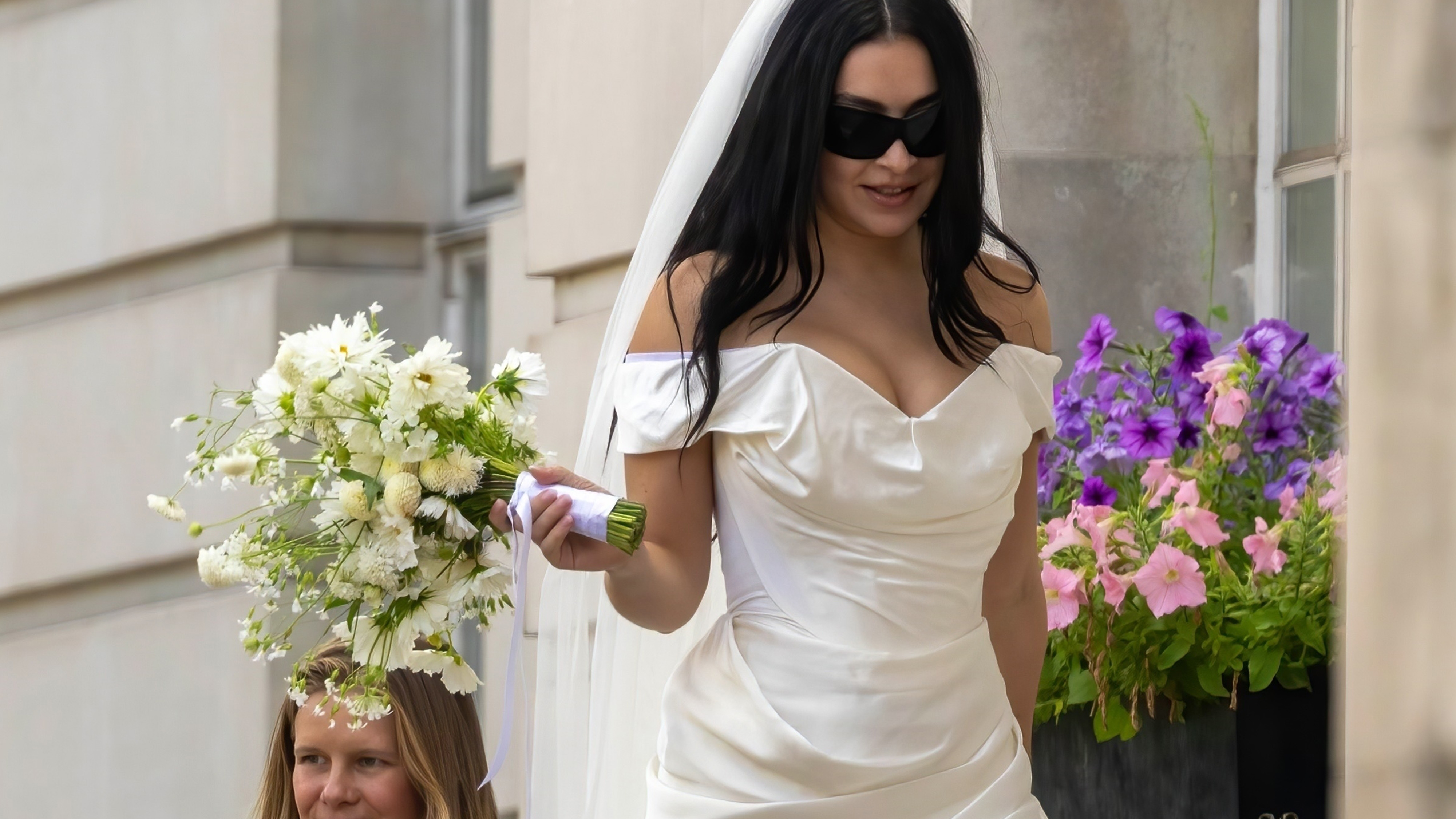Charli XCX wearing a Vivienne Westwood minidress at her courthouse wedding.