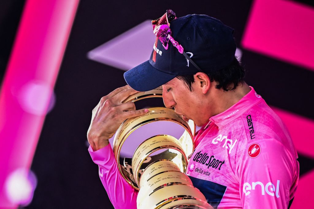 Team Ineos rider Colombias Egan Bernal celebrates with the races Trofeo Senza Fine Endless Trophy on the podium after winning the Giro dItalia 2021 cycling race following the 21st and last stage on May 30 2021 in Milan Photo by MIGUEL MEDINA AFP Photo by MIGUEL MEDINAAFP via Getty Images