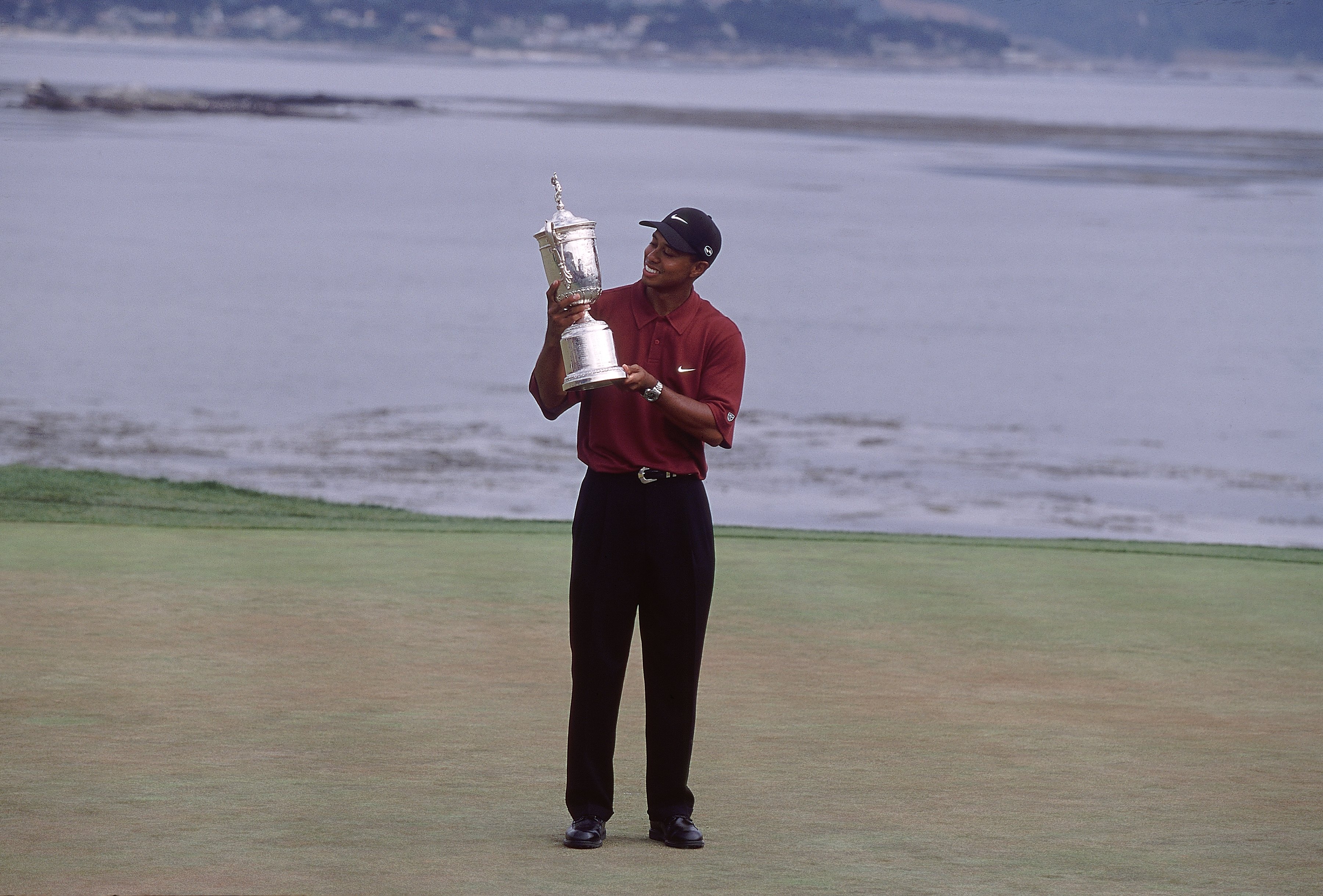 Tiger Woods holds the US Open trophy at Pebble Beach in 2000