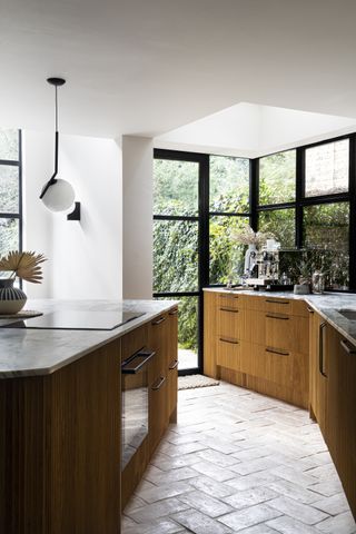 A chopped kitchen island and angular cabinets