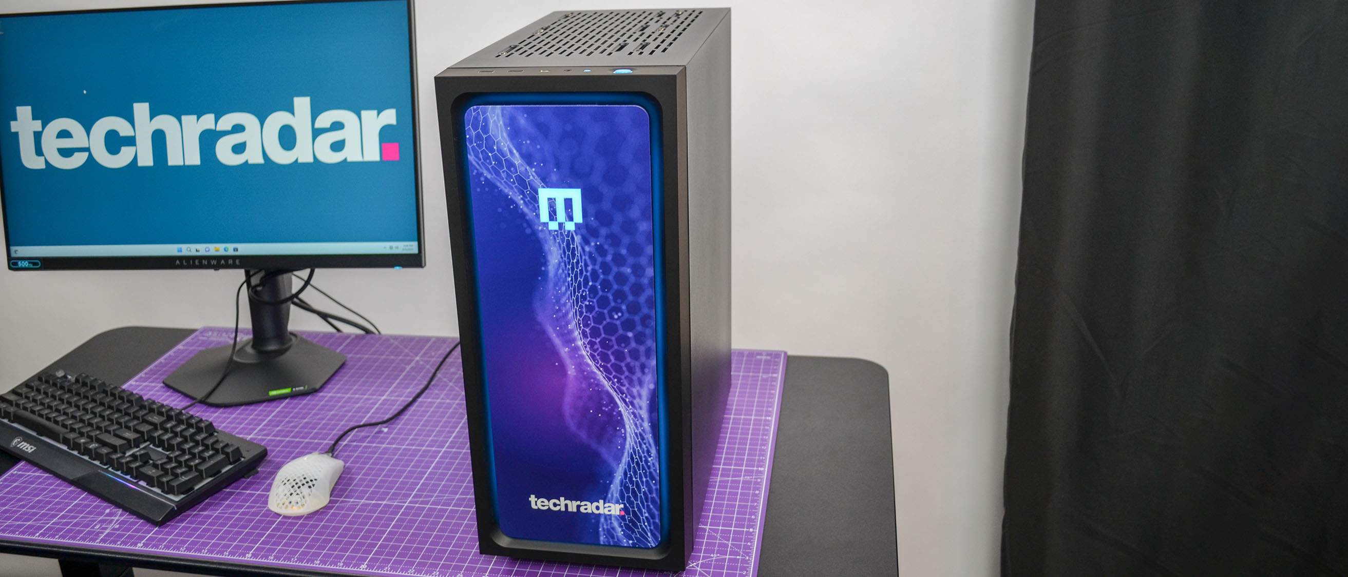 A Maingear MG-1 AMD Advantage gaming PC on a desk