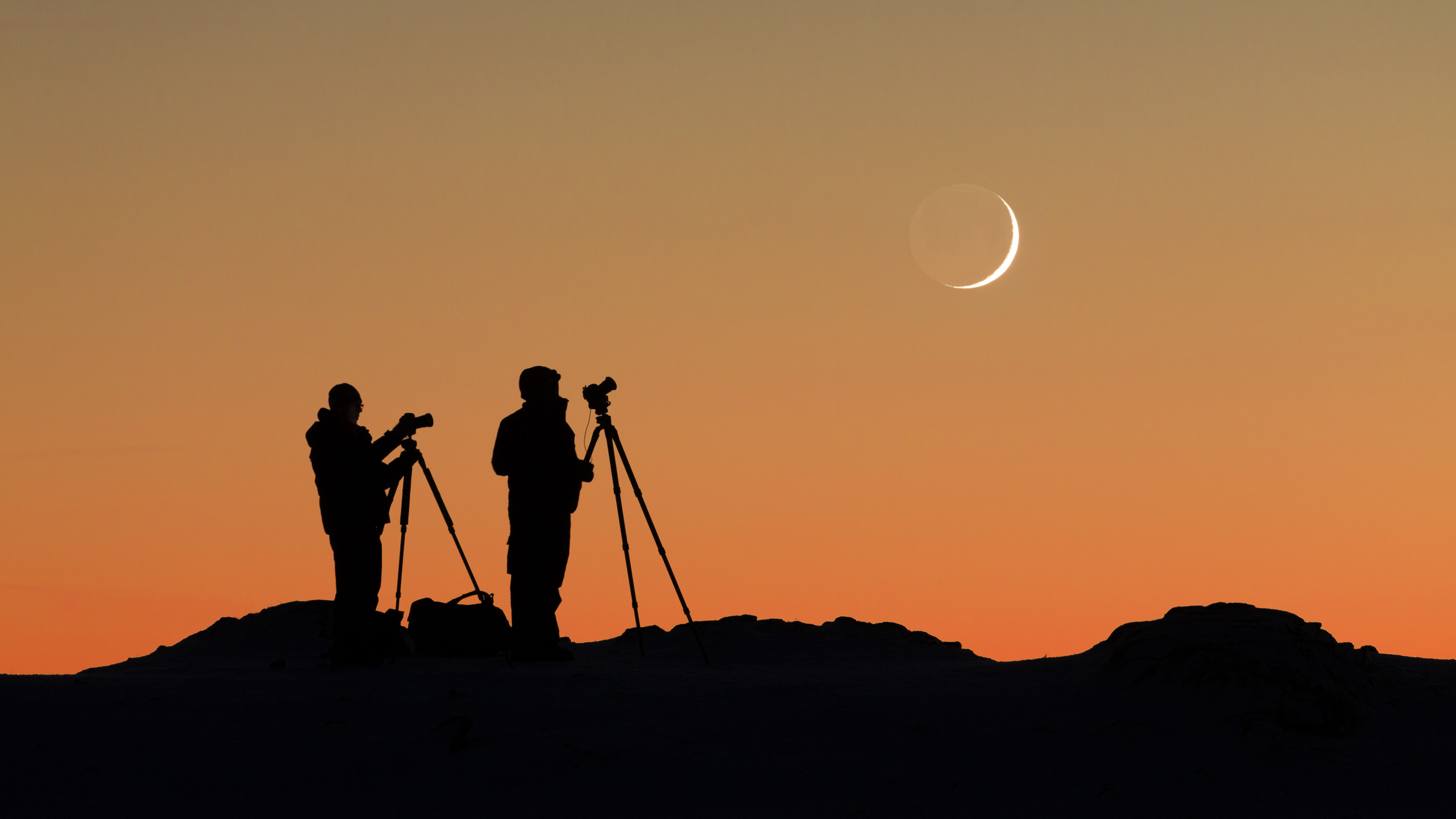 Photographers taking images of moon