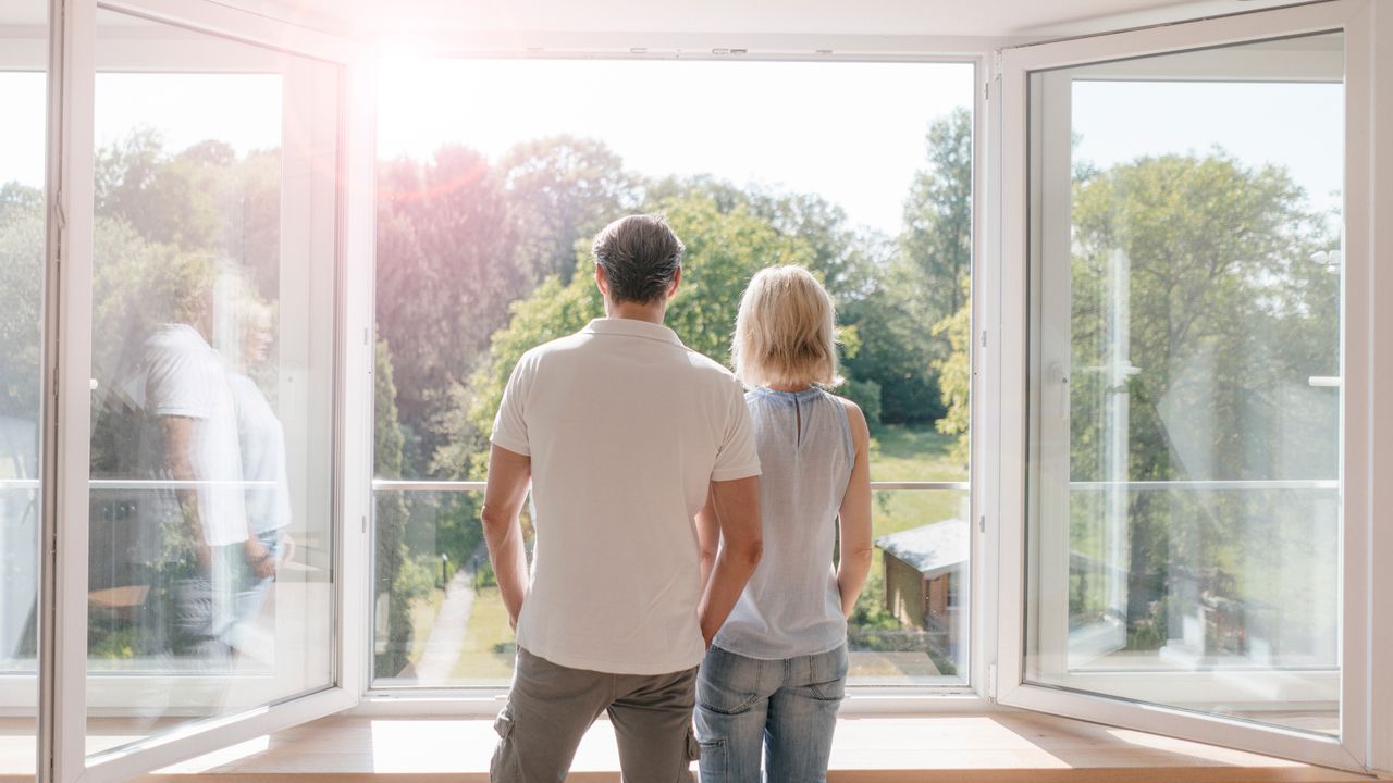 Couple looking out a window