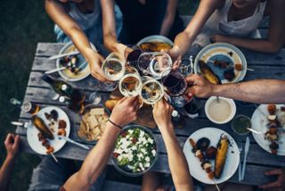 British public favourite food, people toasting drinks over dinner
