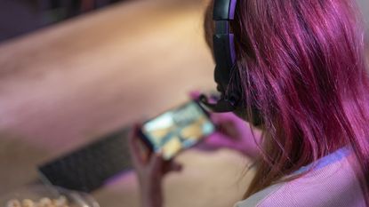 Girl playing games on phone