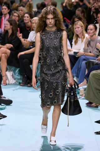 A model walks the Prada spring 2025 runway.