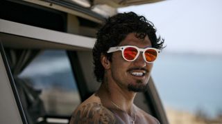 The Oakley Meta HSTN smart glasses being used by a surfer