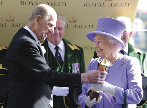 Prince Philip presents his wife with The Queen’s Vase after her filly Estimate triumphs at Royal Ascot in 2012