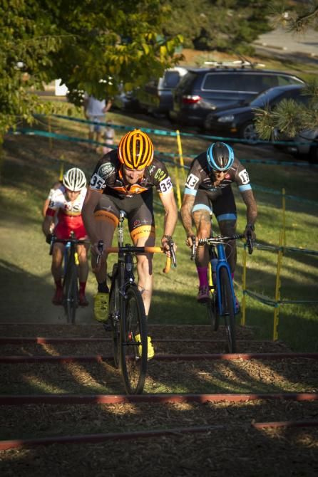 Travis Livermore rides the stairs ahead of Ben Berden