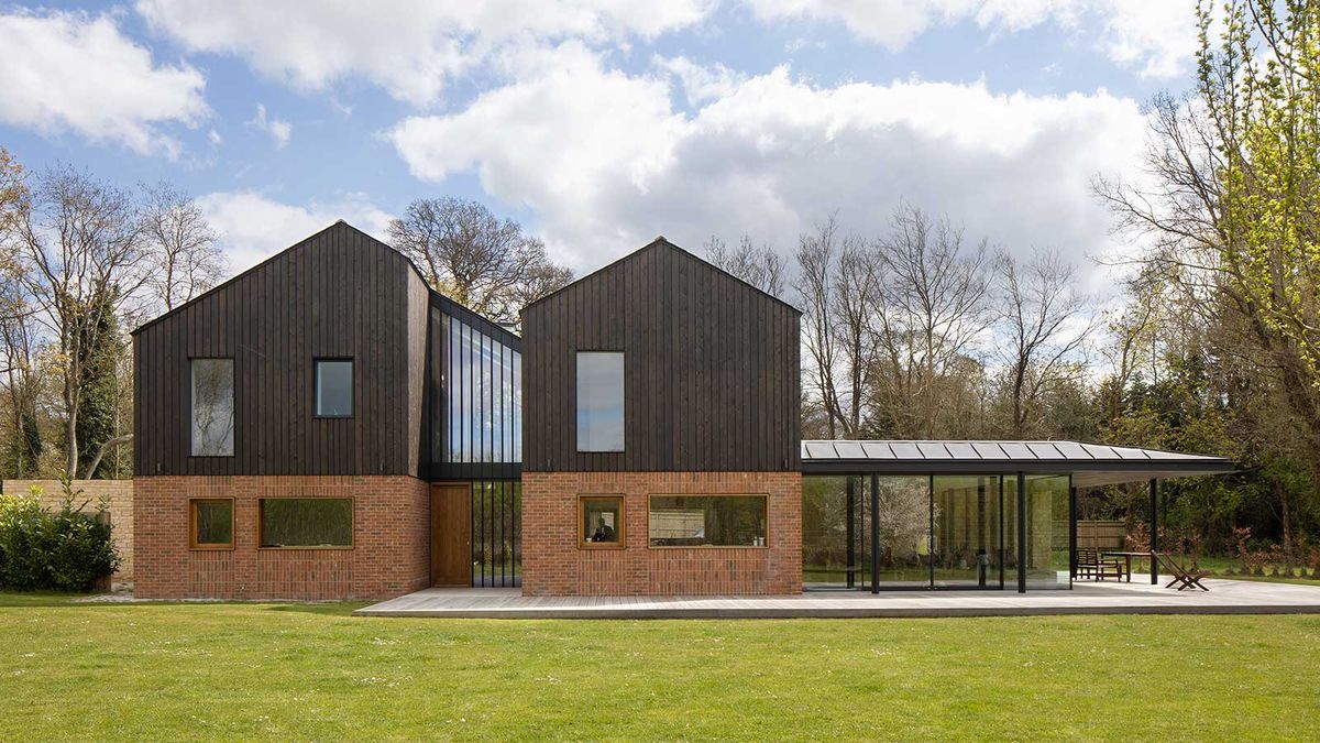 contemporary self-build house with timber cladding and glazed extension