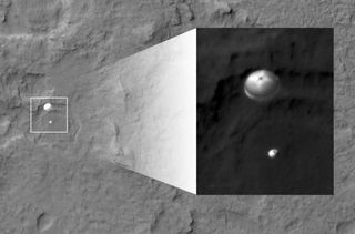 NASA's Curiosity rover and its parachute were spotted by NASA's Mars Reconnaissance Orbiter as Curiosity descended to the surface on Aug. 5 PDT (Aug. 6 EDT) in 2012.