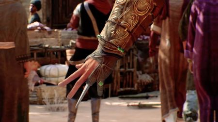 Assassin's Creed Mirage protagonist shows off hidden blade.