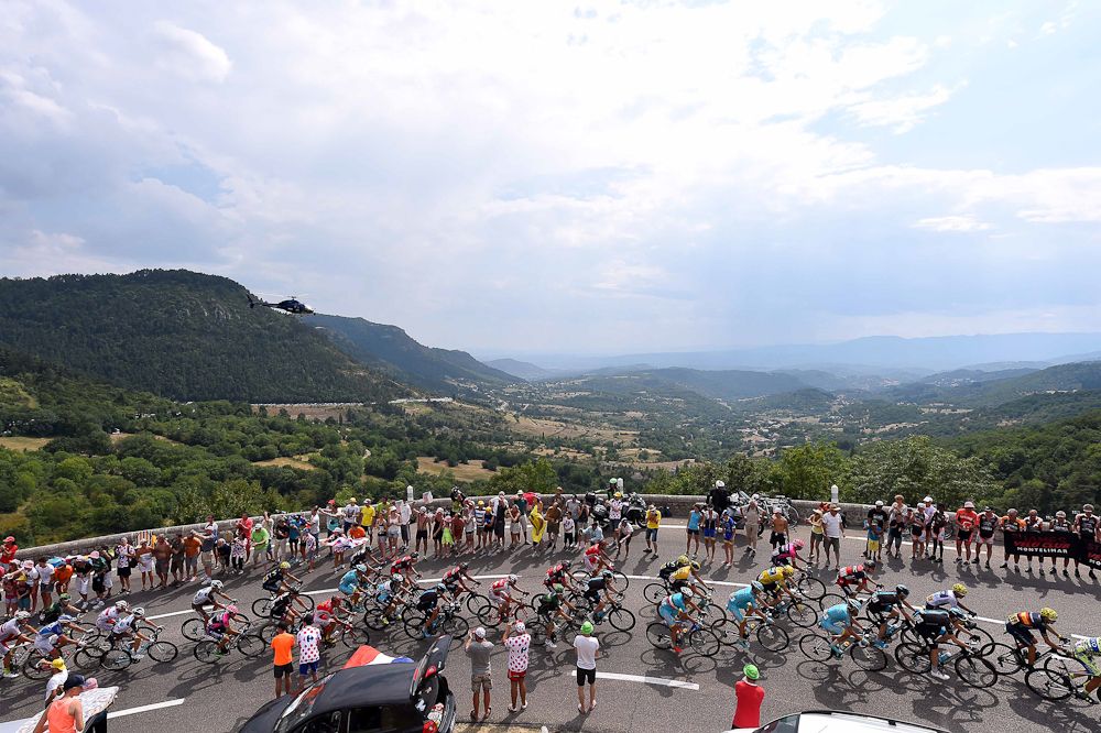 The peloton rolls through the French countryside during stage 15.