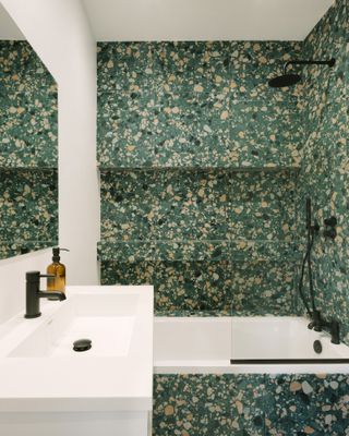 Remi Connoly-Taylor's new home features a bathroom clad in green terrazzo