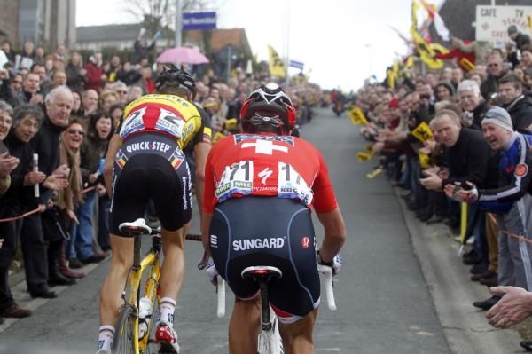 Tom Boonen (Quick Step) and Fabian Cancellara (Saxo Bank) make their way through a corridor of noise at the Tour of Flanders
