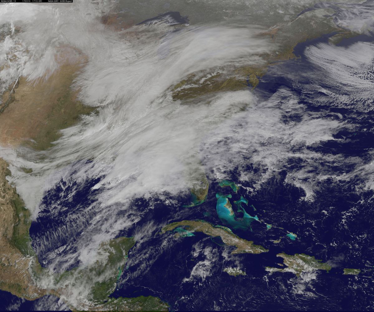 Two low pressure areas coming together on March 13, 2017 will likely cause a heavy snowstorm to hit New England overnight. The clouds associated with those low pressure systems were imaged by NOAA&#039;s GOES-East satellite.