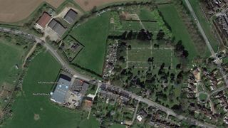 A satellite view of Aylesbury-Vale district in Buckinghamshire, England shows the site where the skeletons were found, at a farm near a graveyard (top center). 
