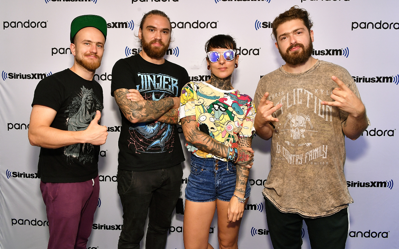 Jinjer against a wall advertising Sirius XM radio