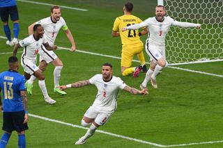 Luke Shaw and his team-mates celebrate after England take an early lead in the Euro 2020 final against Italy at Wembley.