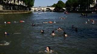 Swimmers cool off in the Seine