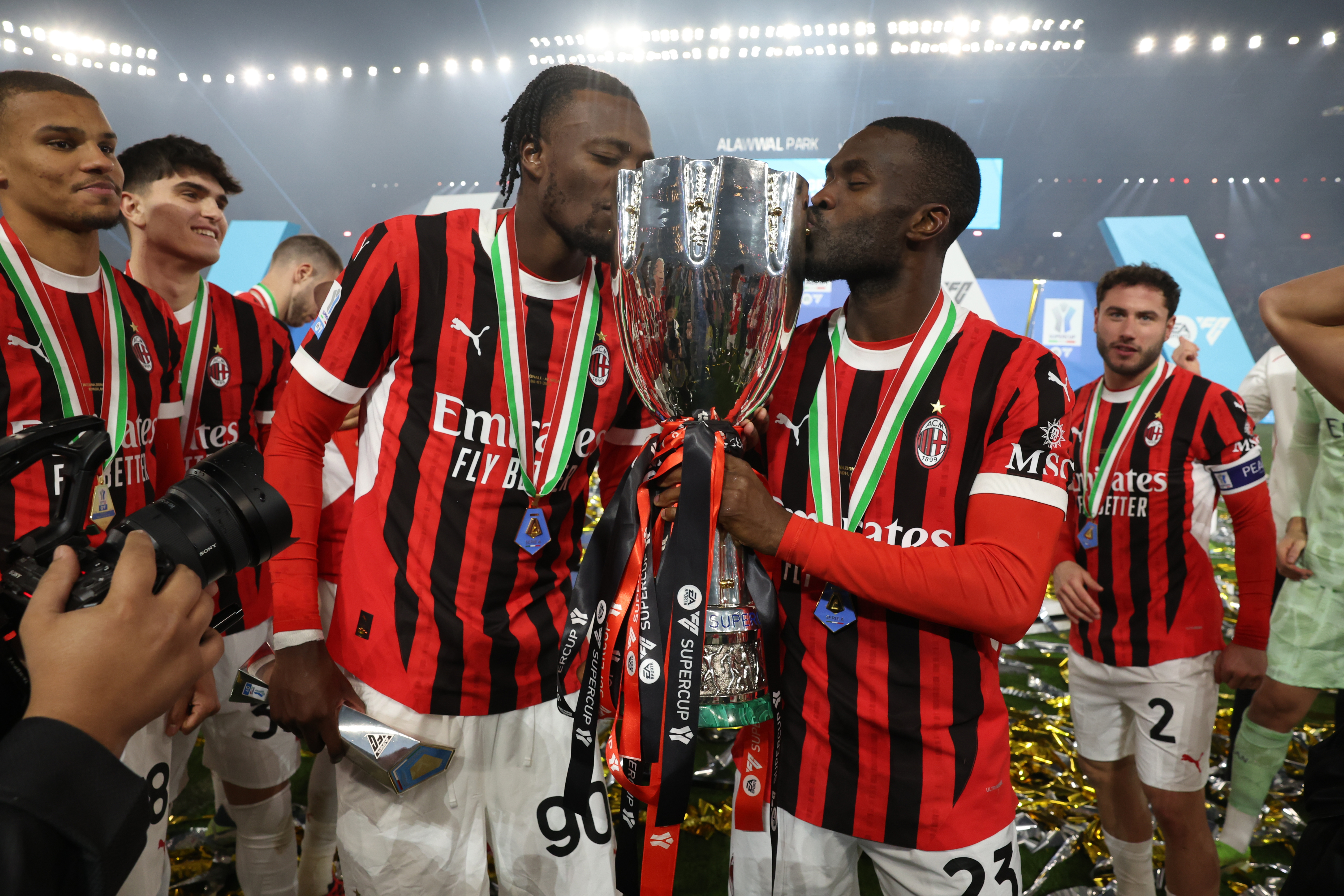 Tammy Abraham and Fikayo Tomori celebrate with the Supercoppa Italiana after AC Milan's win over Inter in the final in January 2025.