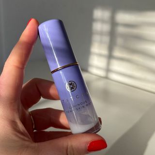 Laura holding Tatcha Luminous Dewy Skin Mist