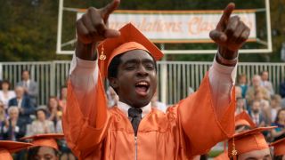 Lucas celebrating graduation in Stranger Things Season 5x08