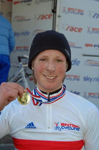 Hugo Robinson shows off his medal after winning the British Cyclo-cross Championship junior race.