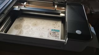 Glowforge pro review, a laser cutter in a room
