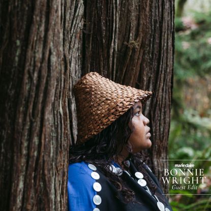 Intersectional environmentalism: A woman sits in the rainforest